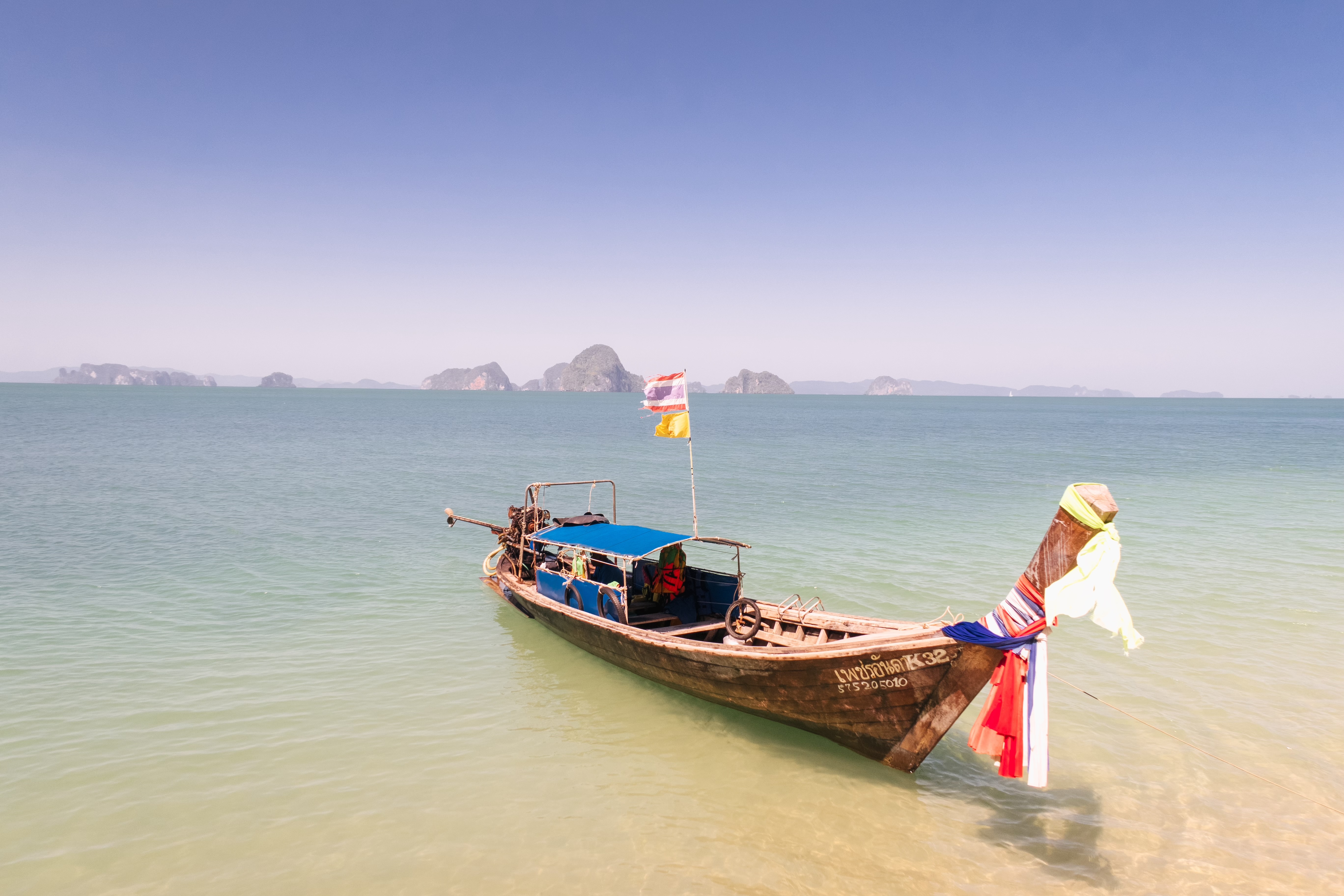 Traditional long boat on beach at Krabi, Thailand